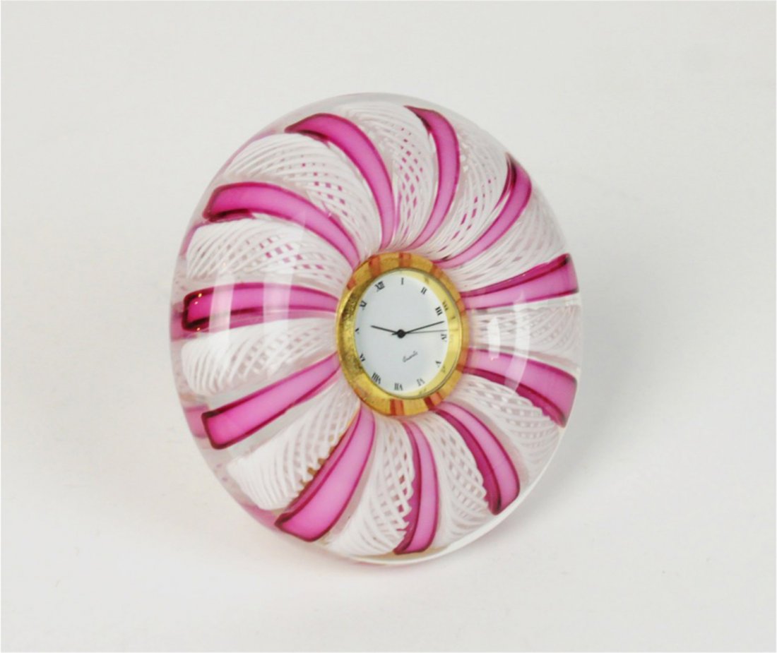 Murano Lattice Ribbon Glass Quartz Clock Italy: Murano white latice and pink ribbon glass round quartz clock. 4.5"D. Condition: Works? May just need new battery. Please examine all photos closely. Contact C. Biddle Auction Gallery for more detailed
