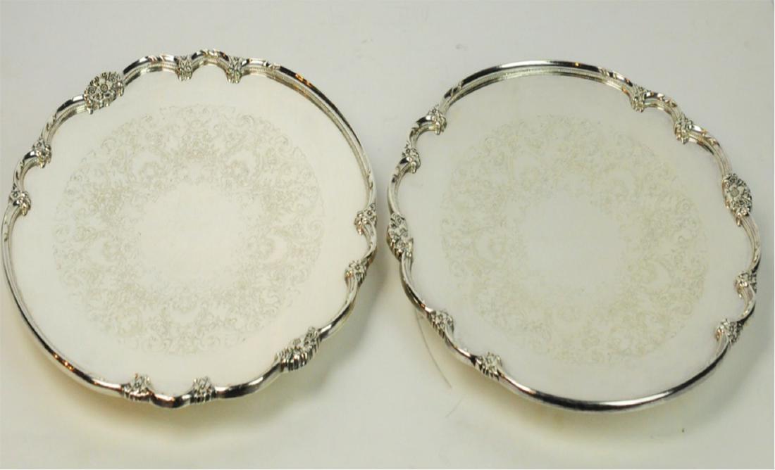 2 Rogers Bros 1847 Silverplate Remembrance Platter: 2 large 'Remembrance' round footed silverplate platters by Rogers Bros 1847. 14.25"D. Condition: Good. Surface scratches from use. Please examine all photos closely. Contact C. Biddle Auction Gallery