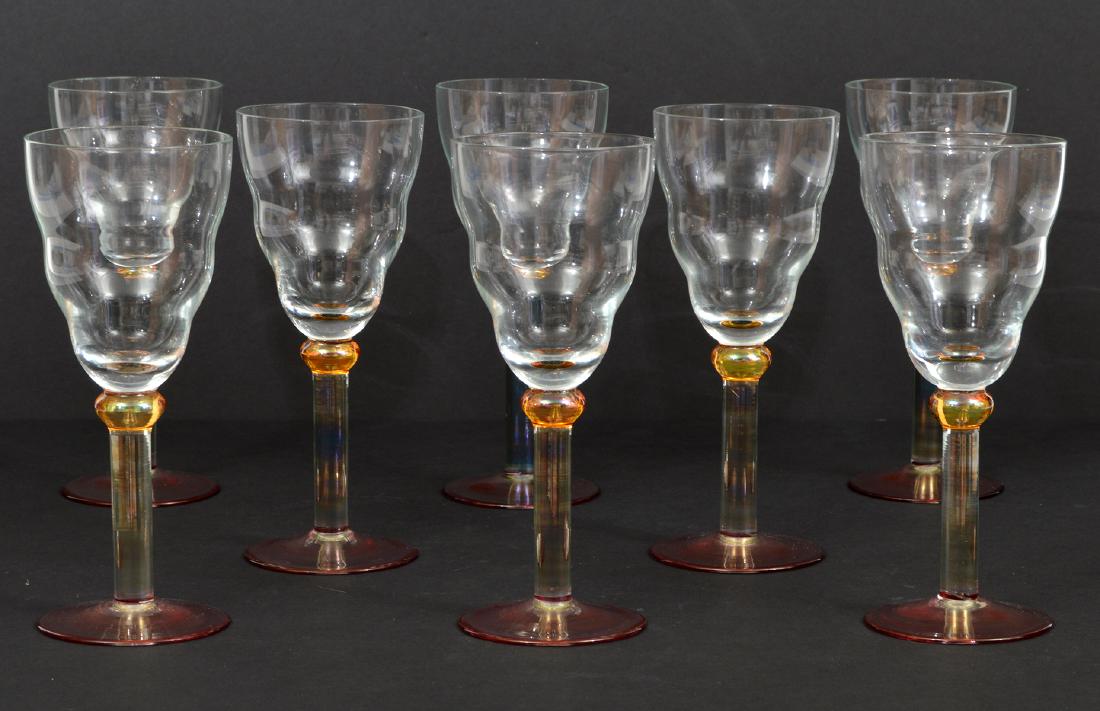 8 Italian Colored Glass White Wine Glasses: 8 Italian white wine glasses with a blue stone, accented with an amber ball and a pink base. 7.5"H. Condition: No chips or cracks. Please examine all photos closely. Contact C. Biddle Auction Gallery 