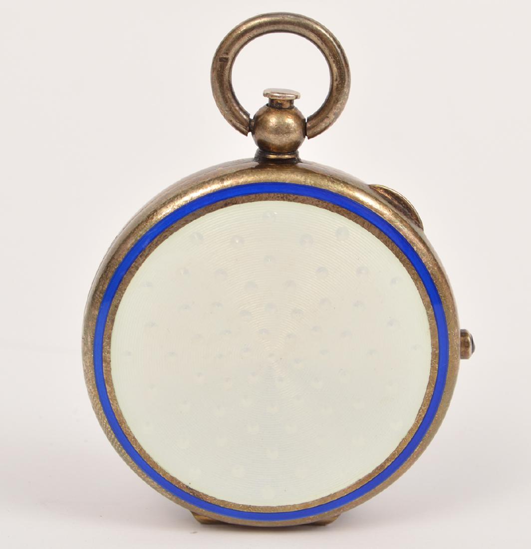 Antique Guilloche Blue White Enamel Pocket Compact: Antique pocket compact with a white & blue guilloche enameling. Inside is a mirror. It opens and closes like a pocket watch with a sapphire crown. 1.75"D. Condition: Very good - no issues. Please exam