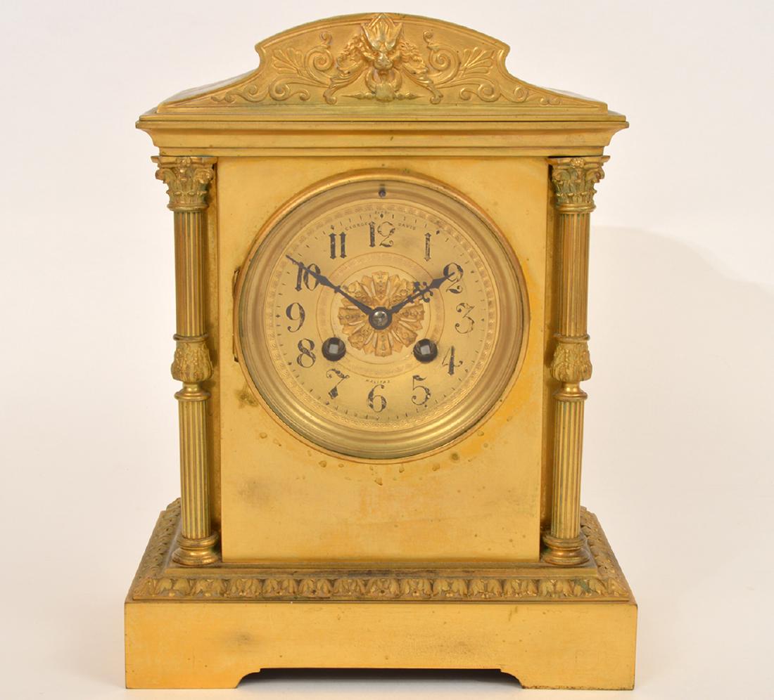 French Bronze Mantel Clock Halifax: French Bronze Mantel Clock Halifax, exported by George Davis, clock is flaked by fluted corinthian columns. With key. Works. 8"L x 5"W x 10.5"H. Condition: Very good. Please examine all photos closely