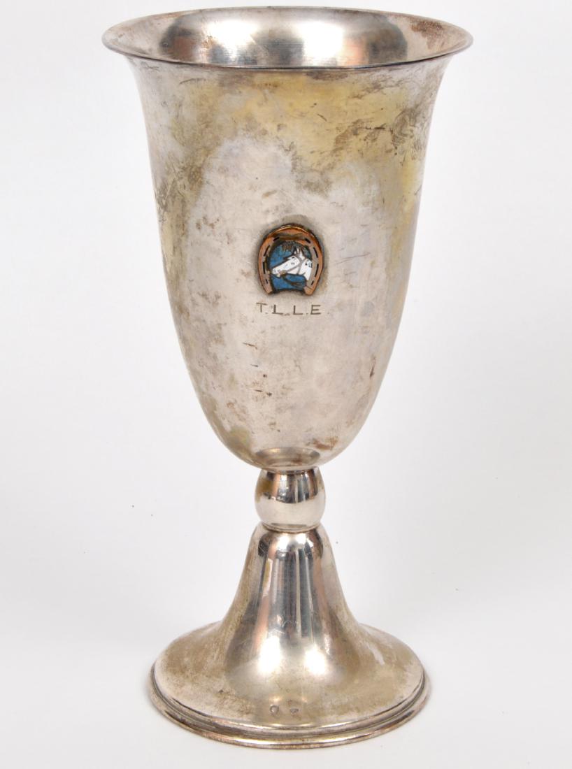 French Sterling Silver Horse Trophy Wine Golblet: French sterling silver horse trophy wine goblet, with an enamel horse framed in a horse shoe. 6.75"H. Weight: 112.3 grams. Condition Report: Very good -chip in enamel. Please examine all photos closel