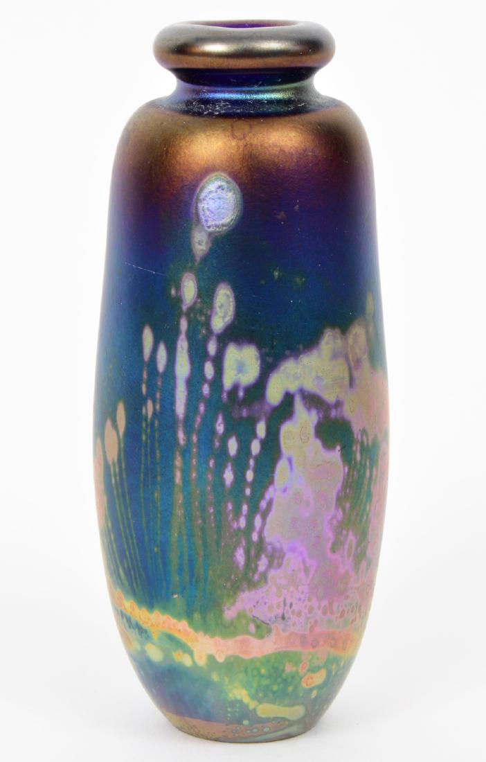 Iridescent Small Multi Colered Vase R. Eickholt: Iridescent small multi colored vase. Signed on bottom R. Eickholt and marked 1987. 5"H. Condition report: Very good - no issues. Please examine all photos closely. Contact C. Biddle Auction Gallery fo