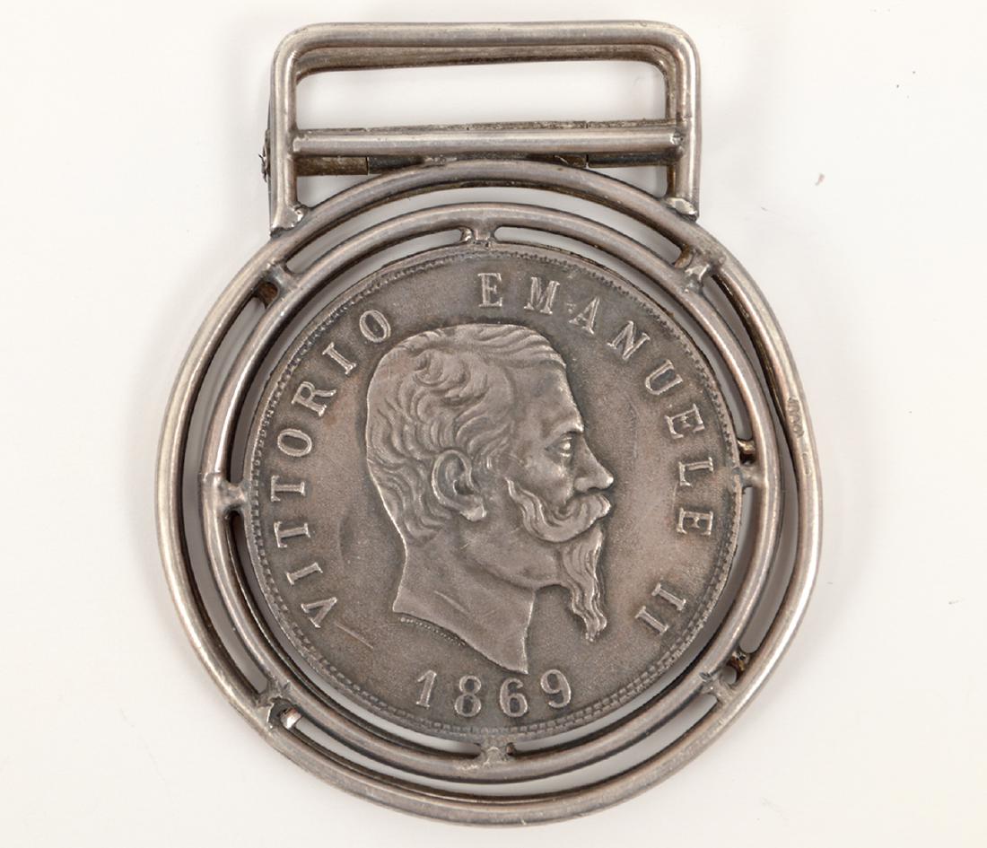 Coin Money Clip Italy Emanuele II 5 Lire 1869: A coin money clip featuring a Vittorio Emanuele II 5 Lire 1869 Milan. The coin is cut in half and the front is framed on one side of the clip and the back of the coin is framed in the other side of th