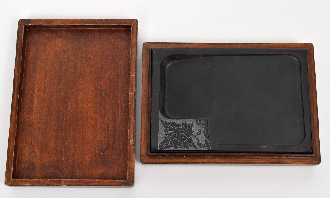 Asian Engraved Slate Ink Pad in Wood Box: Asian Engraved Slate Ink Pad in Wood Box. Slate 7"L x 5.25"W, box 8"L x 5.5" W x 1.5"H. Condition report: Very good - wood box has scratches. Please examine all photos closely. Contact C. Biddle Aucti