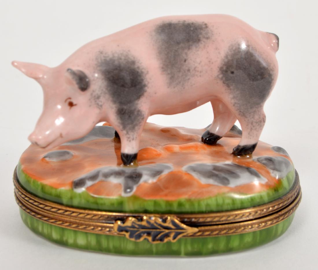 Limoges Peint Main Pig Trinket Box: Limoges, Peint Main, hinged lid box with a pig on the top. Marked on bottom: Point Main, Eximious Limoges France. 2"Hx2.5"L. Condition report: Very good - no cracks, chips or other issues. Please exam
