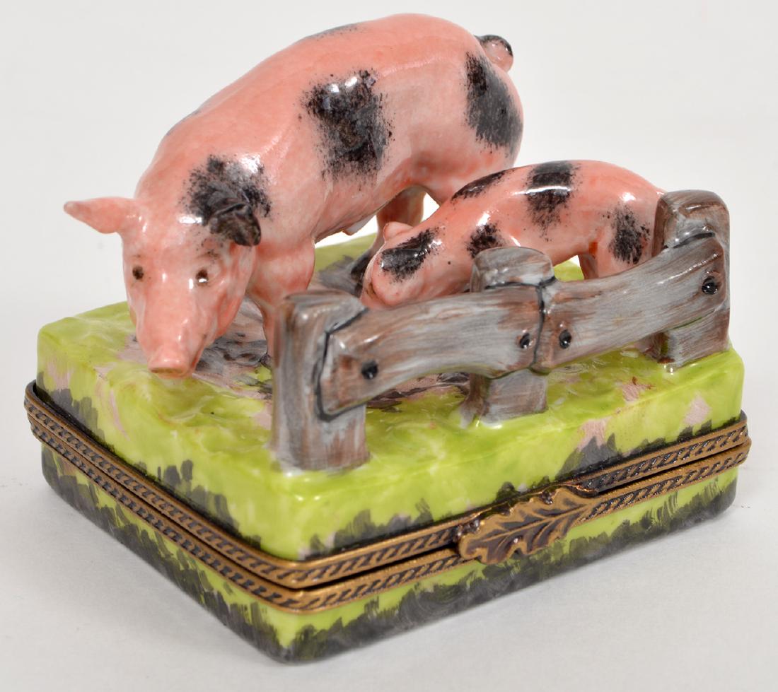 Limoges Trinket Box Pig and Piglet: Limoges, France, hinged lid trinket box with a pig and her piglet near a fence. Marked on bottom: Elda Creations, Limoges, France Peint Mein. 1.5"Hx2.25"Lx1.75"W. Condition report: Very good, no chips