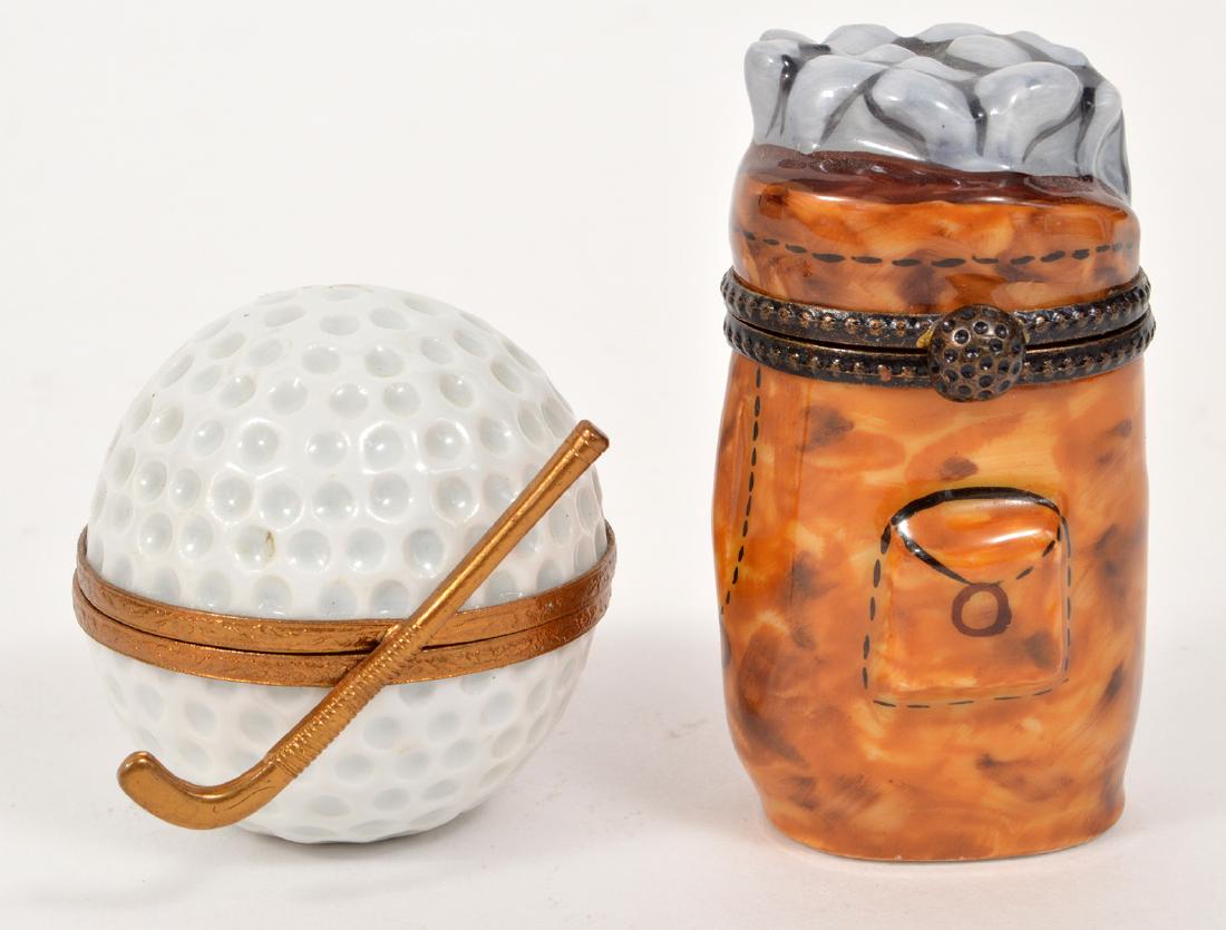 2 Limoges Peint Main Boxes Golf Clubs & Ball: 2 Limoges Peint Main trinket boxes, a set of golf clubs and a golf ball. Both have hinged lids. Marked, Limoges, France, Peint Main. Golf clubs box; 2.5"H, Ball box: 1.75"H. Condition report ; Very go