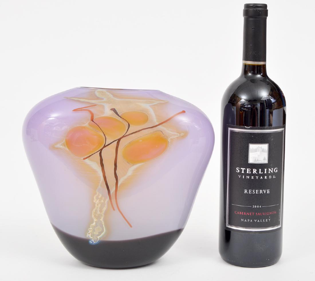 Rick and Janet Nicholson Art Glass Vase 1984: Rick & Janet Nicholson art glass vase in purples and golds. Signed Nicholson, 1984. 8.25"Hx10"Lx4"W. Condition report: Very good - no issues. Please examine all photos closely. Contact C. Biddle Aucti