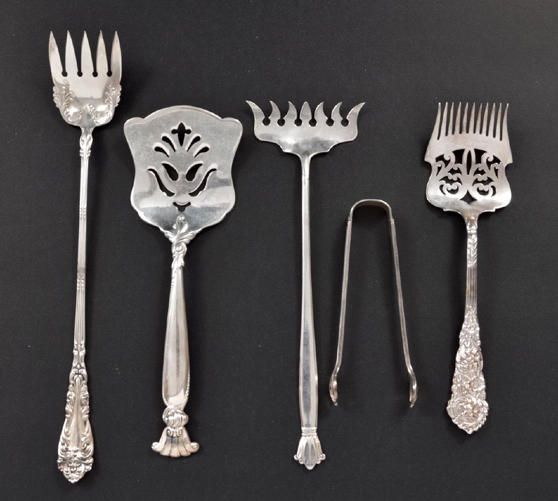 5 Sterling Silver Ware Utensils Wallace Weidlich: 5 sterling silver pieces including: A) Wallace Spatula 6.25"L, 53.9 grams. B) Weidlich sardine fork 6.75"L 23.1grams. C) Reed & Barton Pierced serving fork 6", 35.3 grams. D) Sugar tongs - 3.75"L, 195