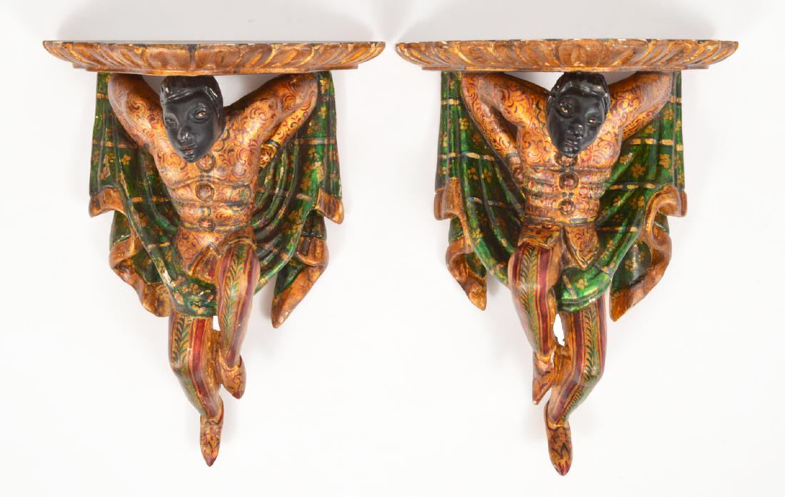 Pair Blackamoor Wall Brackets Painted & Gilt: Pair Blackamoor wall brackets, painted in wonderful green, & red with gold accents, set under a gilt & faux marble platform. 15'H x 12.5" W x 6" D. Condition report: Very good. Please examine all phot