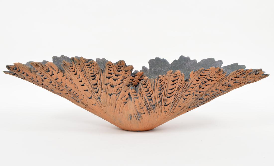 Timothy Moore Ceramic Center Bowl: Timothy Moore terra-cotta center bowl in leaf a pattern. Signed Timothy Moore 88 on the bottom. 27"L x 11" W x 8"H. Condition report: Very good, several flea bites on edges. Please examine all photos 
