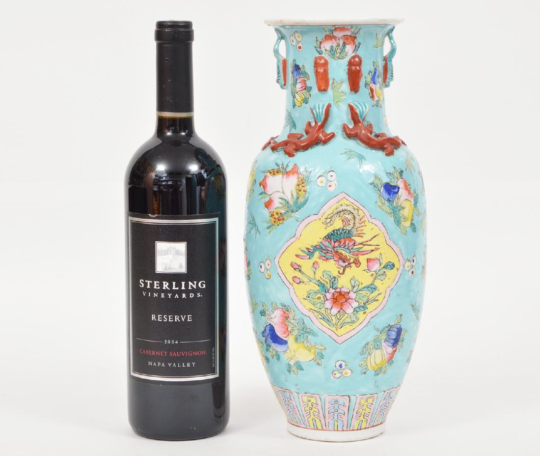 Porcelain Chinese Vase Flowers & Dragon Lizards: Tall Chinese vase in aqua blue textured enamel, hand painted with a floral design. It is accented with applied lizards. 12.5"H. Chinese mark in red on bottom. Condition report: Very good - no chips, c