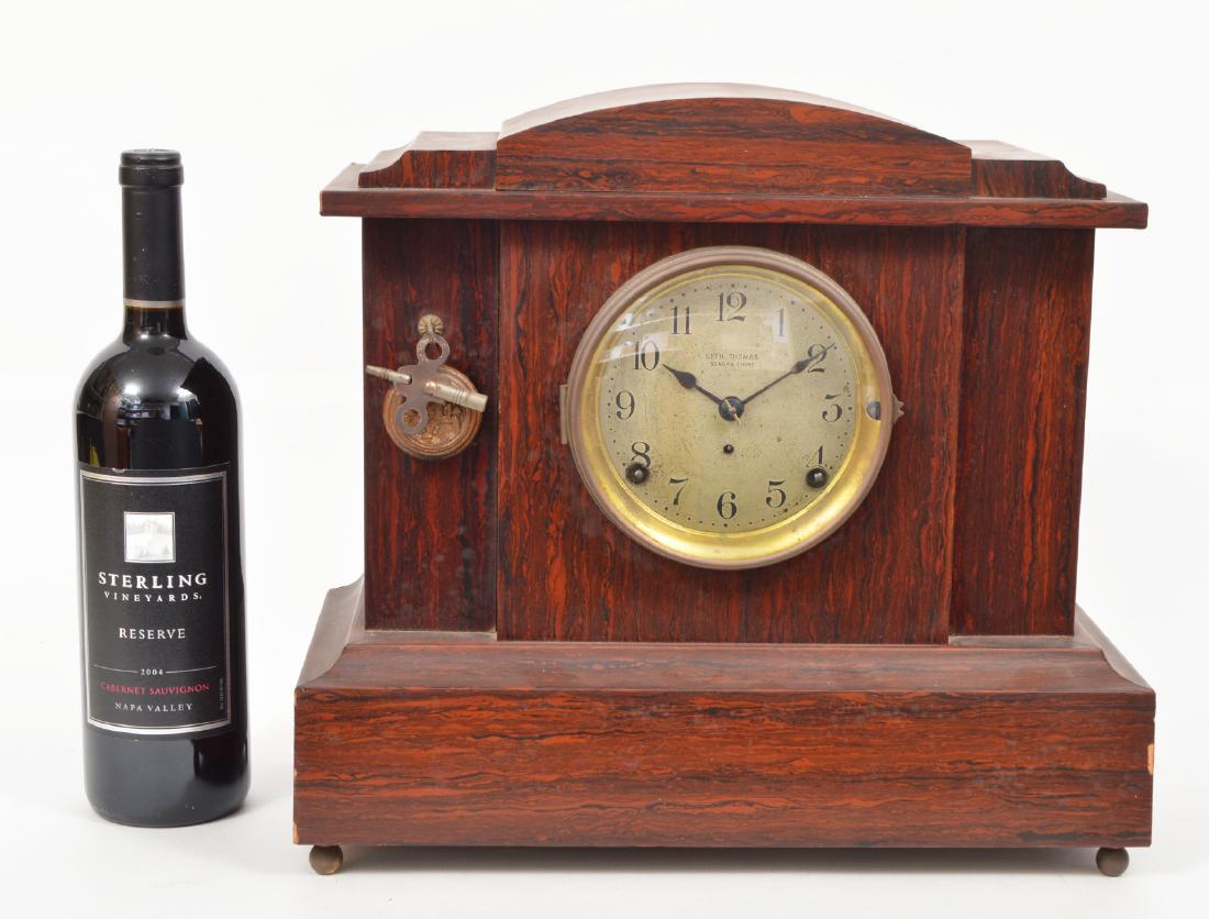 Seth Thomas Mantle Rosewood Clock: Seth Thomas rosewood mantle clock with Sonora chime. 12"Hx14"Lx7"W. Includes key and pendulum. Condition report: Very good- working condition. Please examine all photos closely. Contact C. Biddle Auct