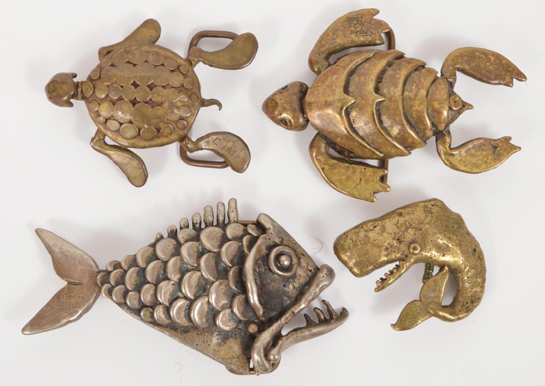 4 Carl Tasha Modernist Brass Belt Buckles Signed: 4 Carl Tasha modernist brass buckles. 2 Turtles, a whale, and a piranha. Signed. Sizes range from 2"-4"L. Condition report: Very good - no issues. Please examine all photos closely. Contact C. Biddle 