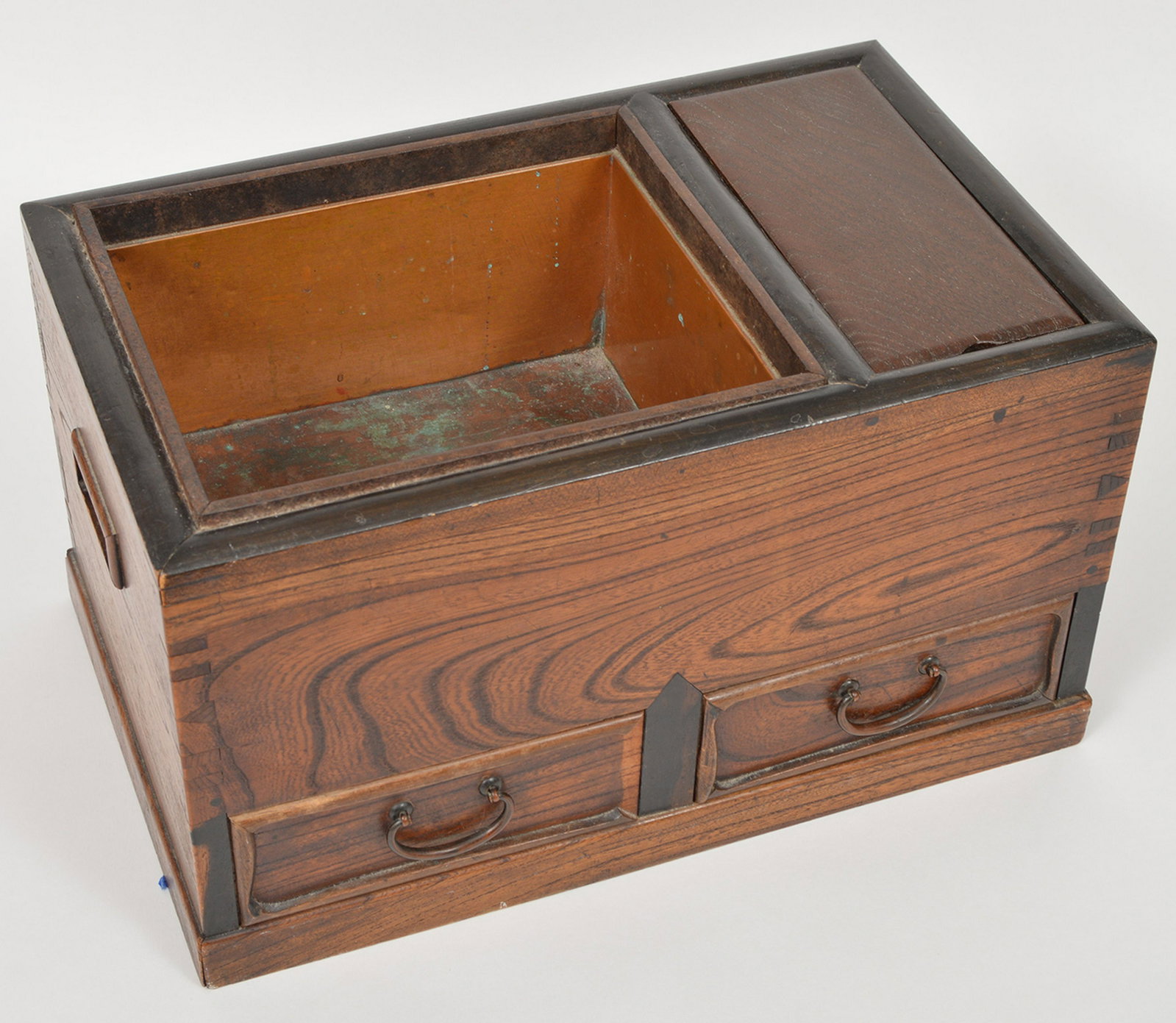 19th c. Japanese Keyaki Wood Tea Hibachi: 19th century Japanese Keyaki wood ceremonial tea hibachi. Meiji period, circa 1880. Features 2 drawers and a copper basin with patina. 8.5"Hx15.5"Lx9.5"W. Condition report: Good- some wear due to use.