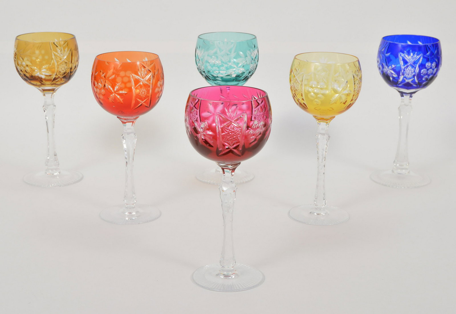6 Bayel Cristal Vineyard Grape Wine Hock Glasses: Set Of 6 Bayel Cristal Vineyard Grape Cut To Clear Wine Hock Glasses, 2 Amber, Cobalt Blue, Cranberry, Emerald Green, Amethyst. 6 7/8"H x 2 7/8" W. Condition report: Very good, no issues three glasses