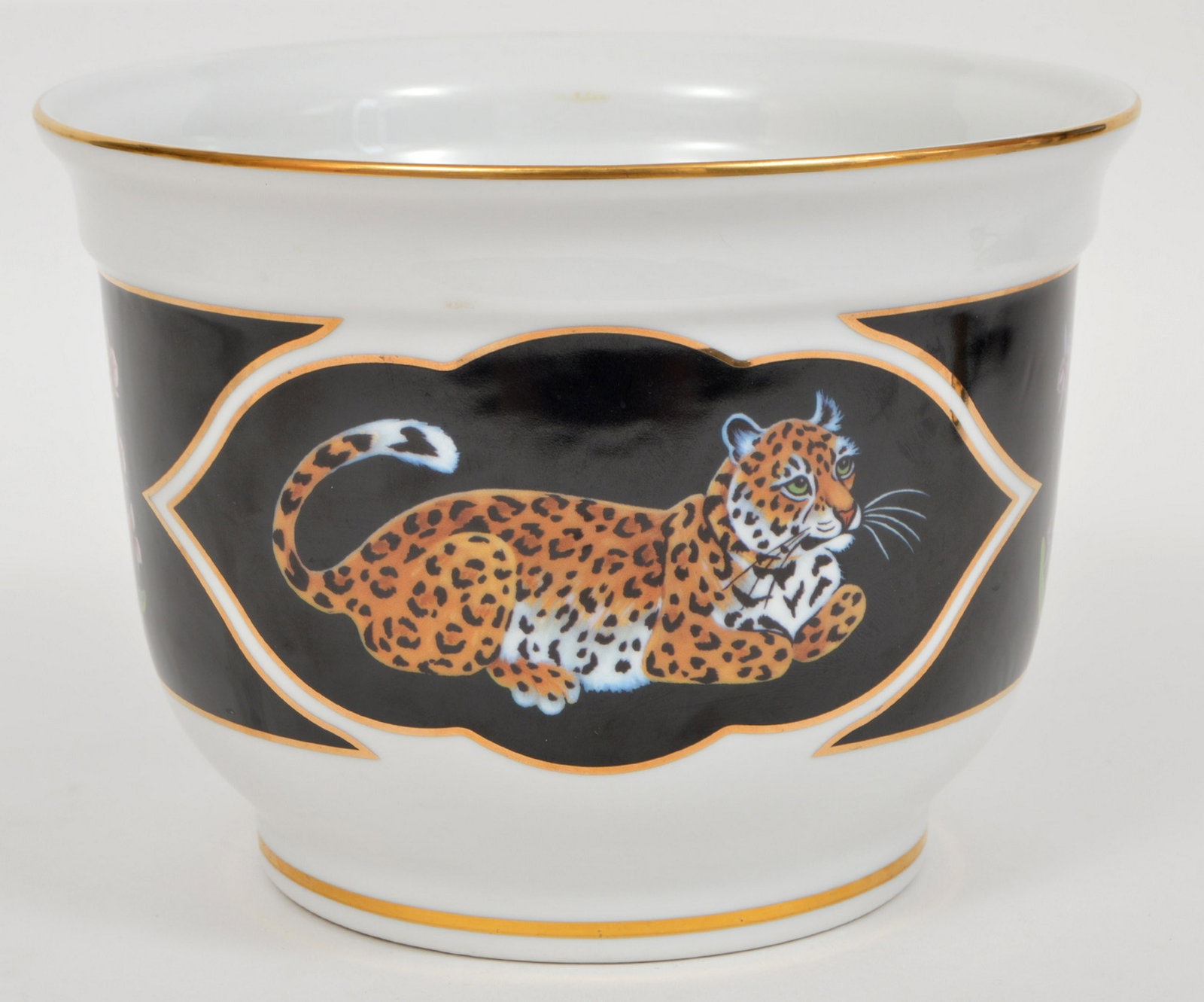 Lynn Chase Jaguar Jungle Planter 1998: Lynn Chase Jaguar Jungle planter in white porcelain with an animal and flower design. 6"H x 8.25"D. Condition Report: Very good - no issues. Please examine all photos closely. Contact C. Biddle Auctio