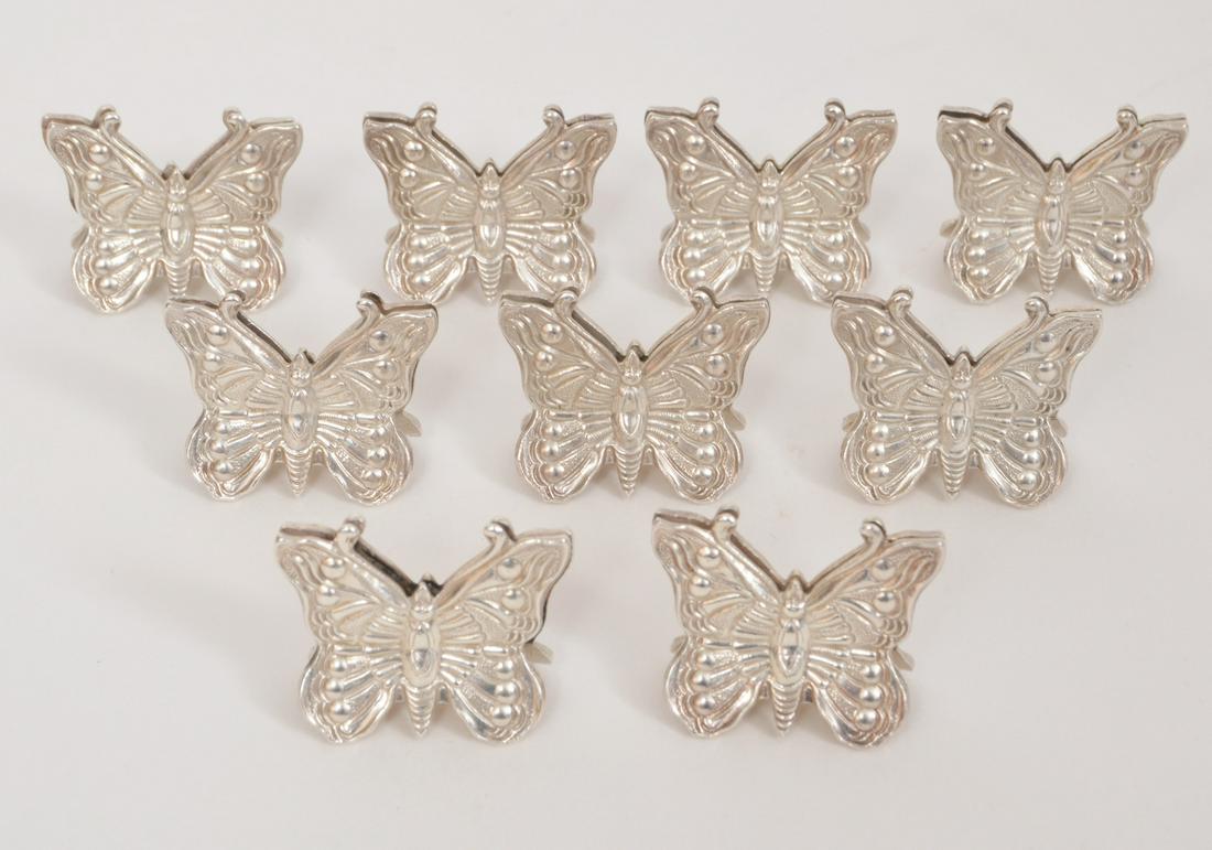 9 Tiffany & Co Sterling Butterfly Place Holders: 9 Tiffany & Co sterling silver butterfly place holders. Total Weight: 84 grams. Marked Tiffany & Co. sterling. 1"H x1 1/8"W. Condition report: Very good - no issues. Please examine all photos closely.