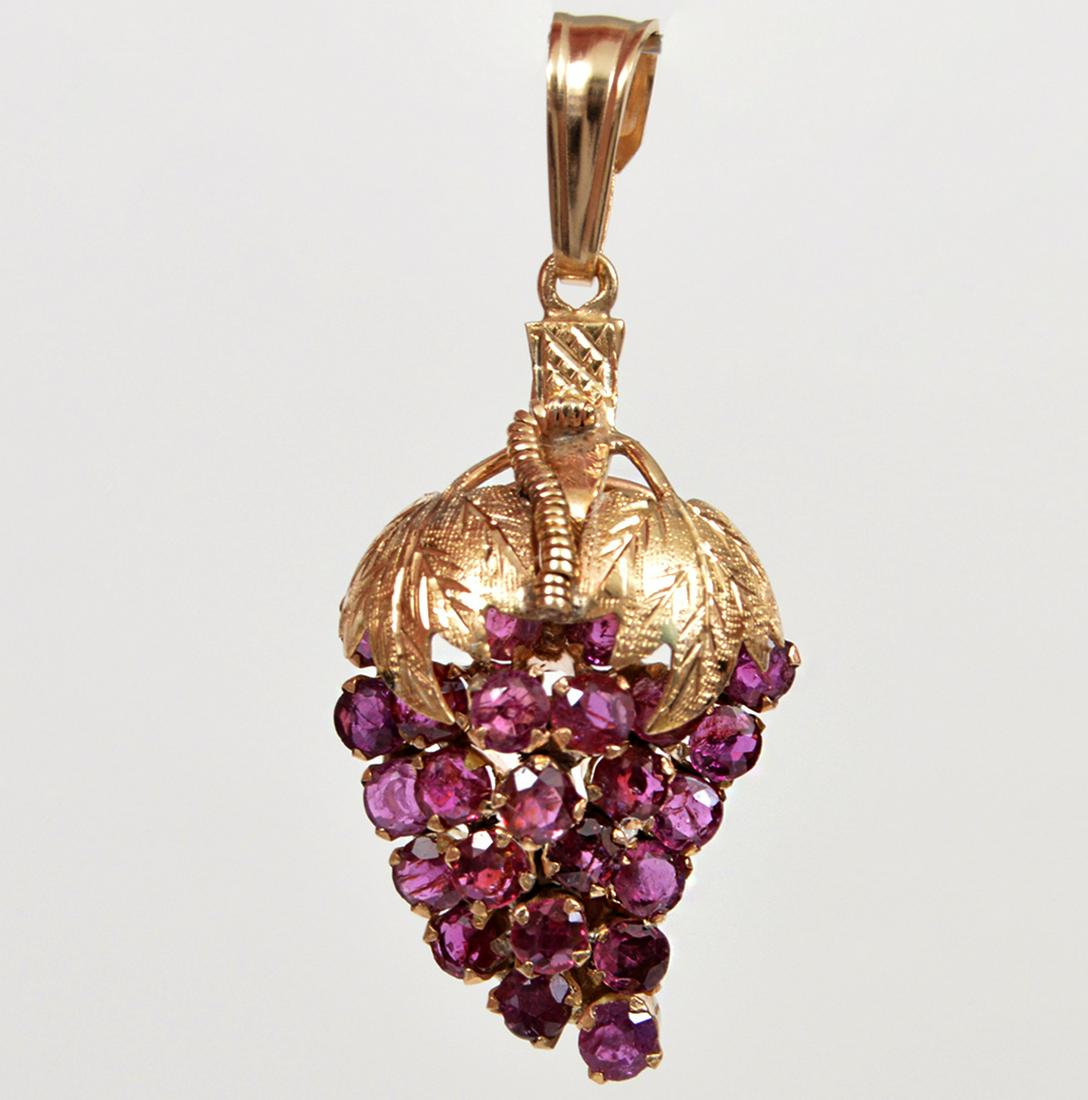 14k Yellow Gold Ruby Grape Pendant: 14k yellow gold, ruby pendant, featuring approximately 2ctâ€™s of faceted round rubies in a grape cluster design. 1.5" drop. WT: 4.2gms. Please examine all photos closely. Contact C. Biddle Aucti