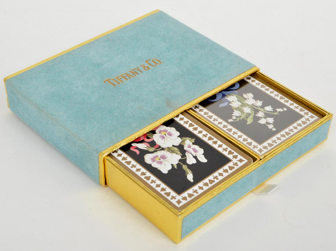 Vintage Tiffany & Co. 'Flower' Playing Cards: Vintage Tiffany & Co. 'flower' playing cards, 2 packs, one is in original wrapper. 4" x 5". Condition report: Good, one pack has been gently used, and a slight stain on the box. Please examine all pho