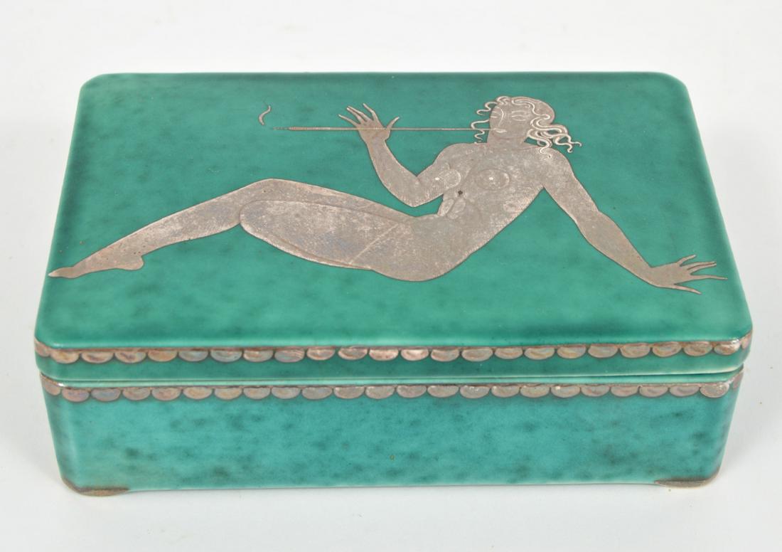 Gustavsberg Argenta Covered Box Silver Overlay: Gustavsberg Argenta, rectangular covered box with silver overlay decoration on the lid, of a reclined nude woman smoking a cigarette on a long holder, silver overlay trim on both the box & lid, and cr