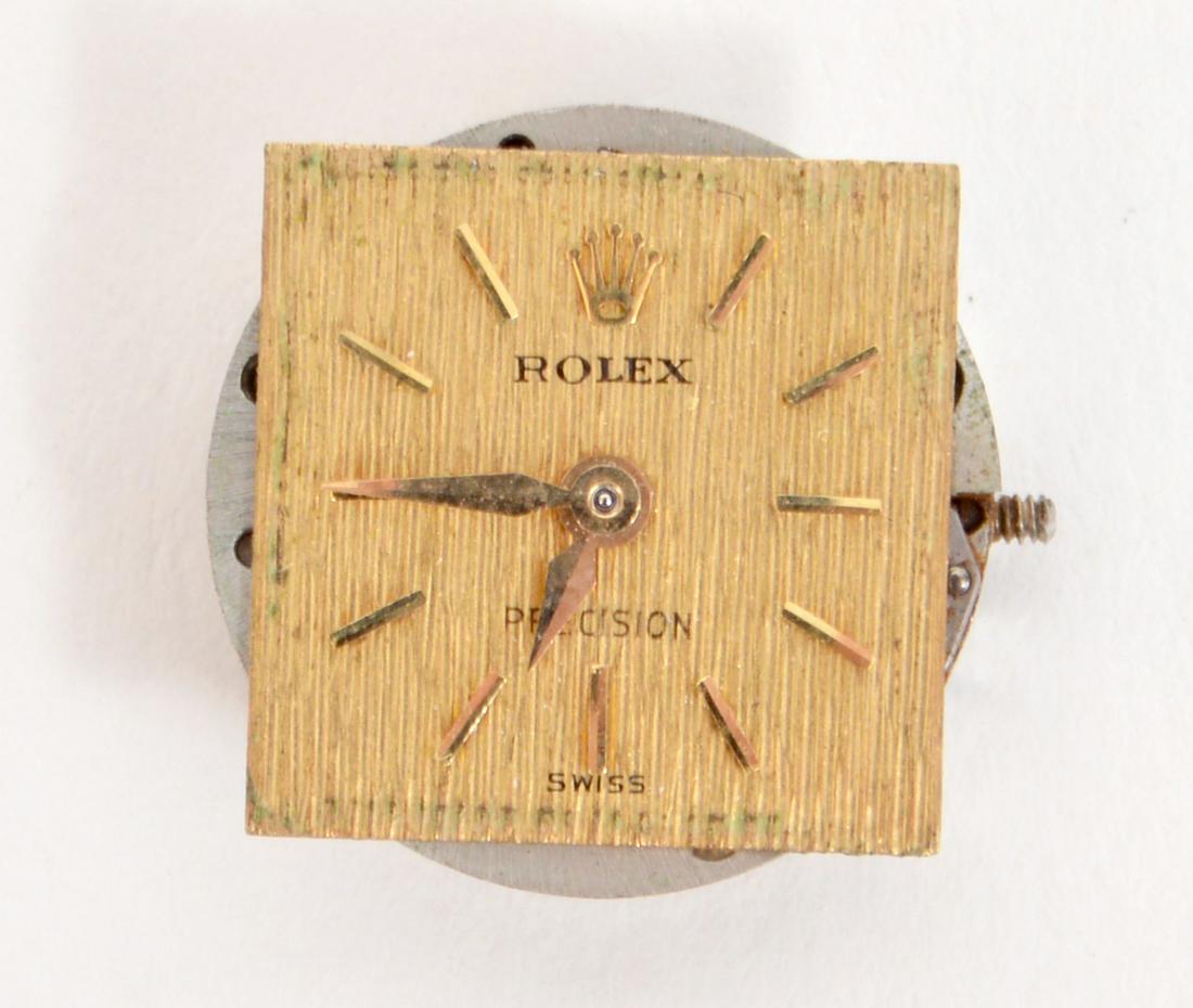 Rolex Works & Face Only Precision Swiss 18 Jewels: Rolex Works & Face Only, Precision Swiss 18 Jewels, textured gold face. 13.7mm, face size 11.9mm x 12mm. Wind up. Condition report: being sold as is, see photos. Please examine all photos closely. Con