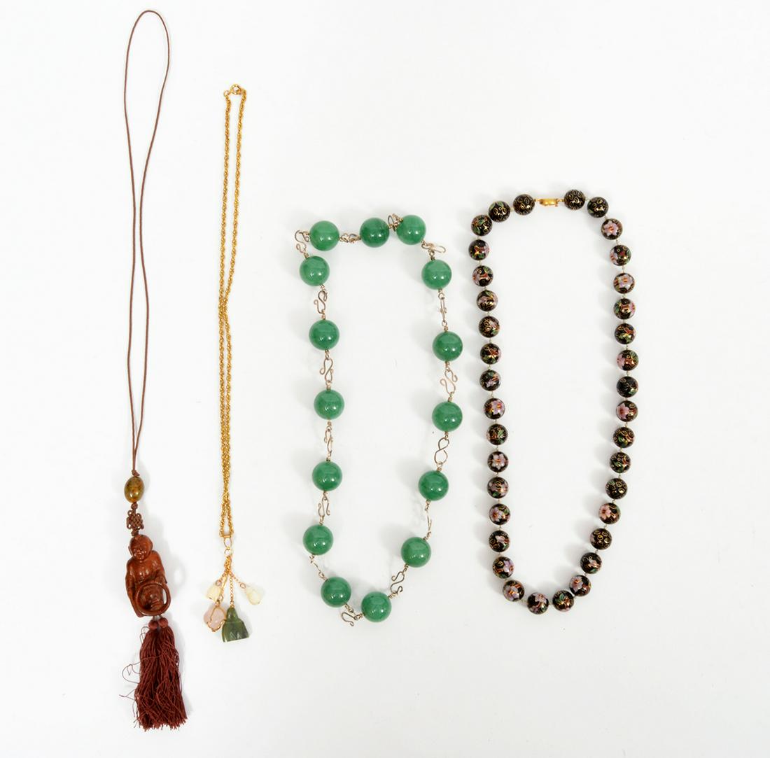 3 Chinese Necklaces, CloisonnÃ© Jade Wood: A lot of 3 necklaces including a strand of 12mm cloisonne beads, 22"L, a strand of 20mm green onyx bead necklace, 23"L, a Wood carved pedant of a asian child with a toy hanging a cord with tassels, 24