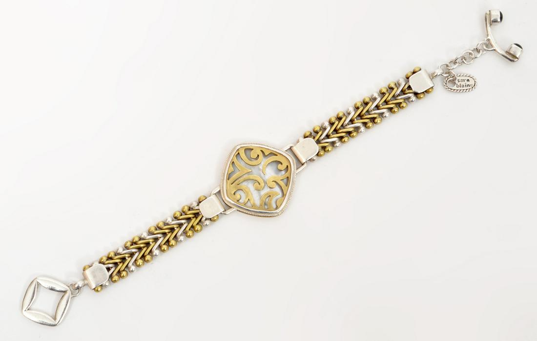 Sara Blaine Sterling Mother of Pearl Bracelet: Sara Blain "Fusion" sterling silver bracelet featuring a mother of pearl center with 18k gold vermeil accents. 7.5"L. Signed. 37 grams. Condition report: Very good - no issues. Please examine all phot