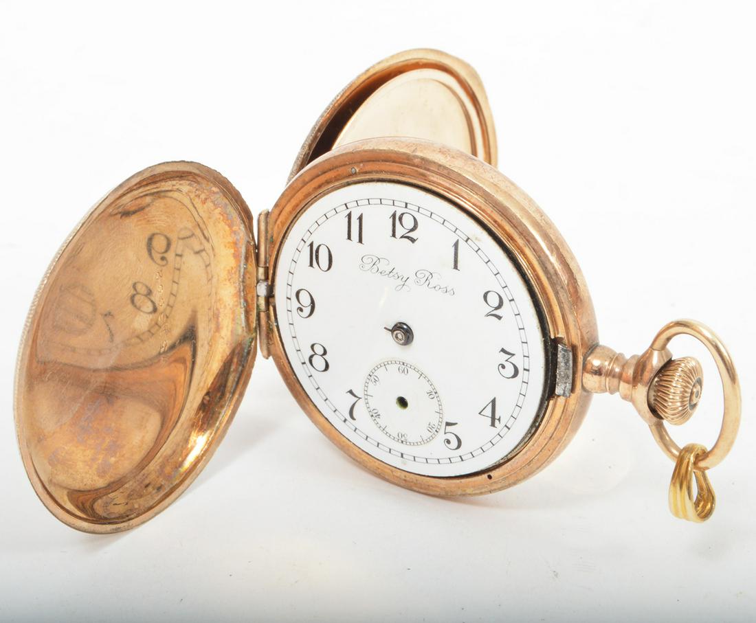 Betsy Ross Keystone Pocket Watch: Betsy Ross Keystone pocket watch with porcelain face. 1.25" diameter. Condition report: No crystal and No hands. Not running. Please examine all photos closely. Contact C. Biddle Auction Gallery for m