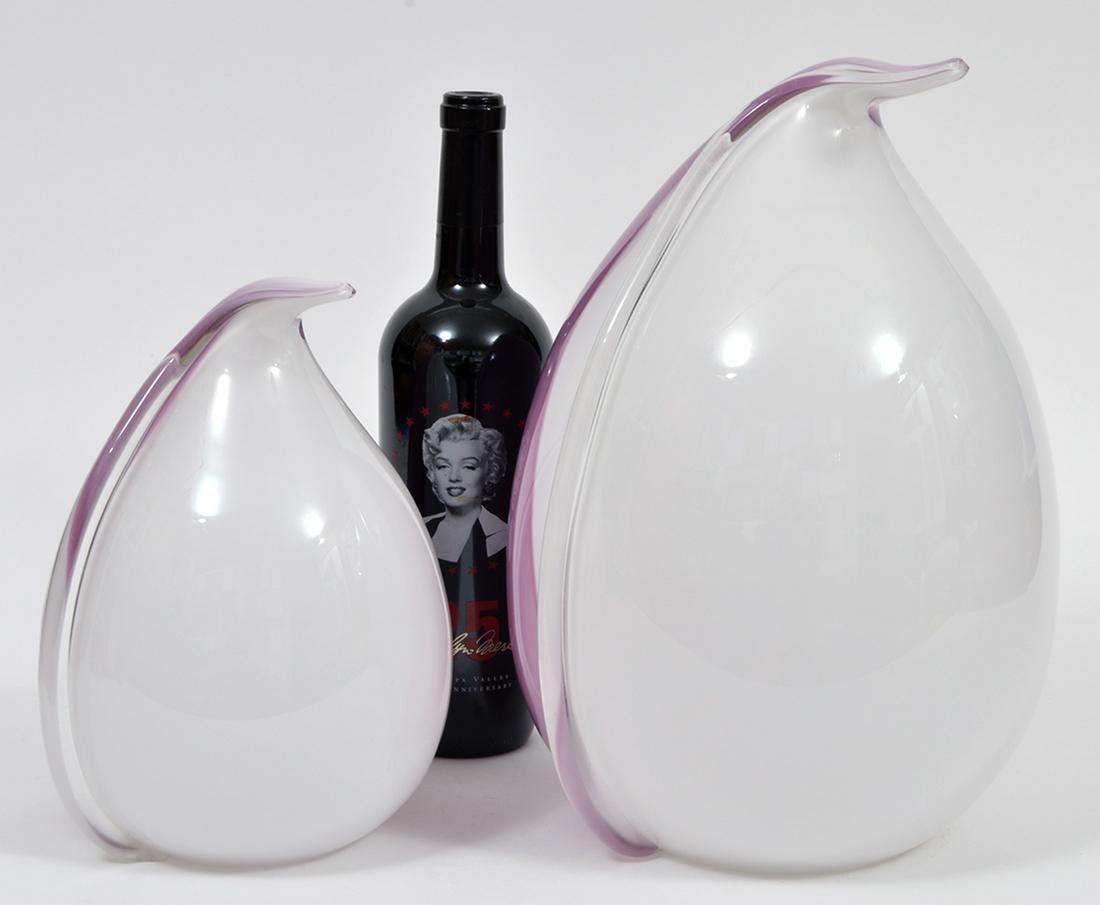 2 Enormous Murano Art Glass Penguins: 2 enormous Murano Art Glass (in the style of Vennini) penguins in lavender and white. The larger one has a small drilled hole - probable for a lamp cord. 13.5"H x 10"W and 9.75"H x 7.5"W. Condition re