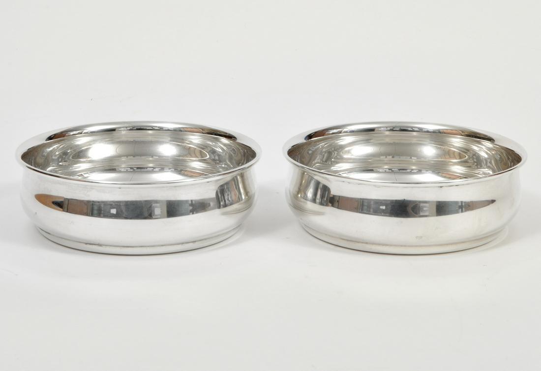 2 Tiffany & Co Sterling Wine Bottle Coasters: 2 Tiffany & Co sterling silver wine bottle coasters. 4.75" diameter. 266 grams. Condition report: Very good - no issues. Please examine all photos closely. Contact C. Biddle Auction Gallery for more d
