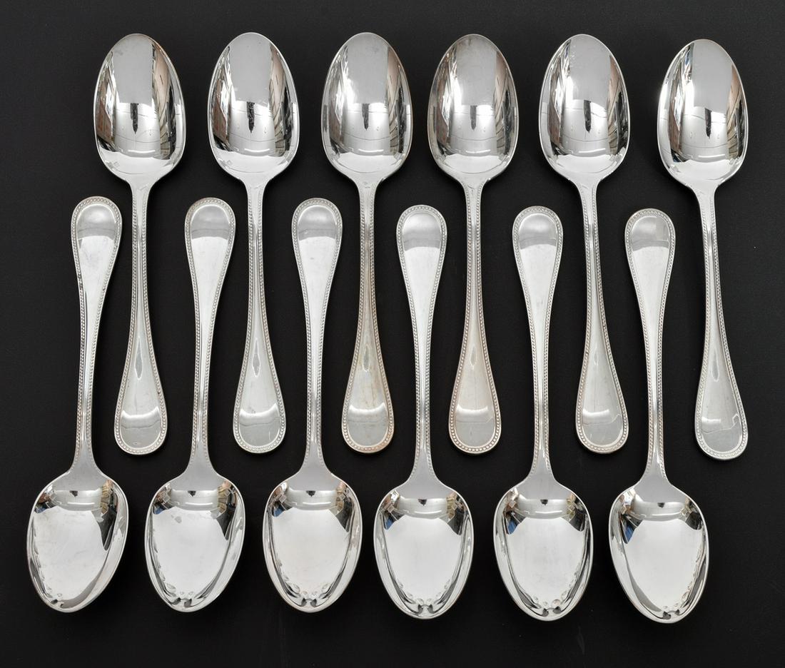 12 Christofle 'Perles' Silverplate Sauce Spoons: 12 Christofle silverplate sauce spoons in 'Perles' pattern. Measures 7.5"L. Condition report: good condition, no issues, see photos. Please examine all photos closely. Contact C. Biddle Auction Galler