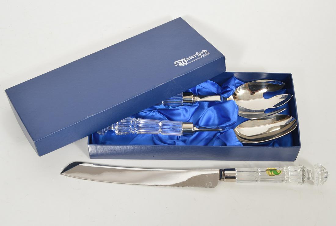 Waterford Crystal Salad Tongs & Bread Knife: Waterford Crystal Salad Tongs in original box & Bread Knife. Salad tongs: 10.5" L. Bread knife: 13.5". Condition report: Very good. Please examine all photos closely. Contact C. Biddle Auction Gallery