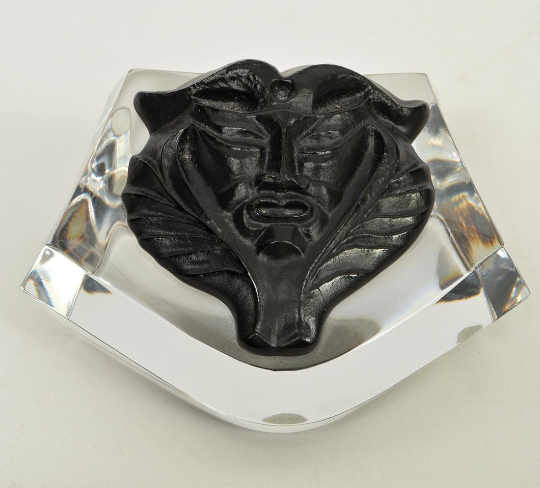 Lalique Crystal & Black Satyr Mask Paperweight: Lalique crystal & black Satyr Mask paperweight. Signed. 2"H x 4"L x 3"W. Condition report: Good - no issues. Please examine all photos closely. Contact C. Biddle Auction Gallery for more detailed info