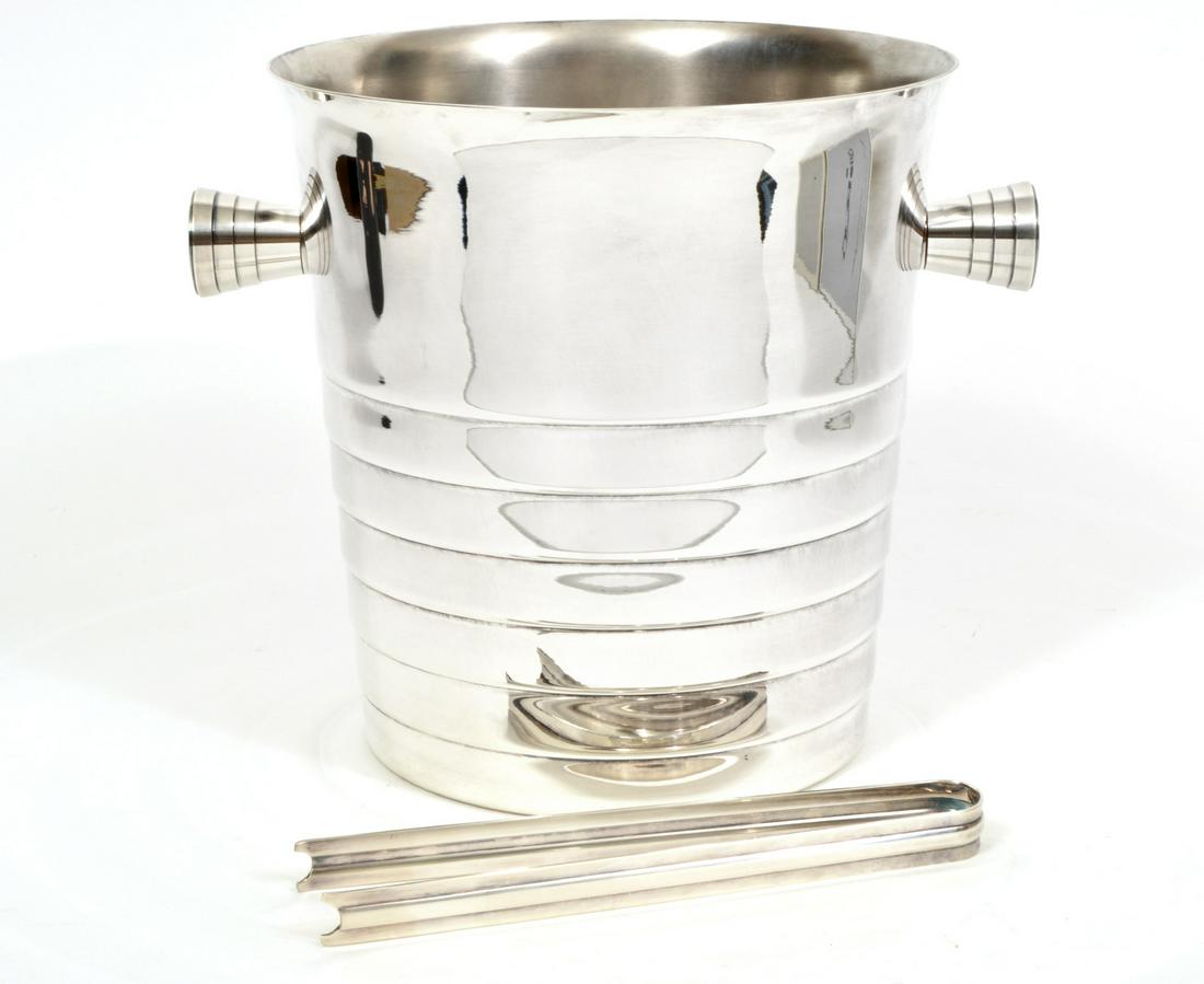Christofle Champagne Bucket & Tongs: Christofle silverplate champagne bucket or wine cooler with incised lines around handles and body. Marked on base. Measures 8.25"H x 10"W with handles. Ice tongs are 7.5"L. Condition report: good cond