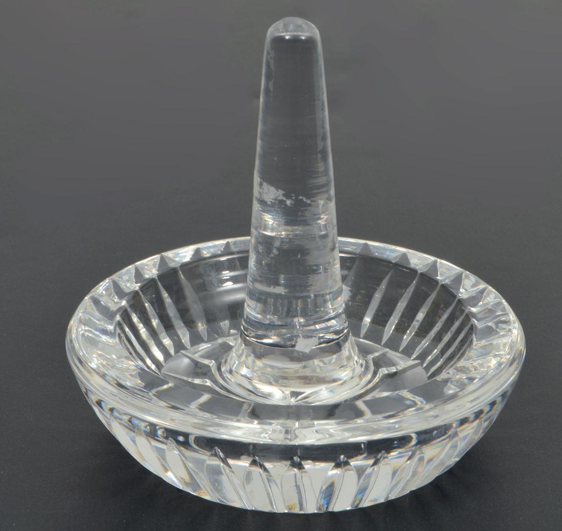 Waterford Crystal Ring Holder: Waterford crystal ring holder, signed on bottom. Features a smooth central spike for stacking rings and a round ridged tray for storing small pieces of jewelry. Measures 3"H x 3"W. Condition report: g