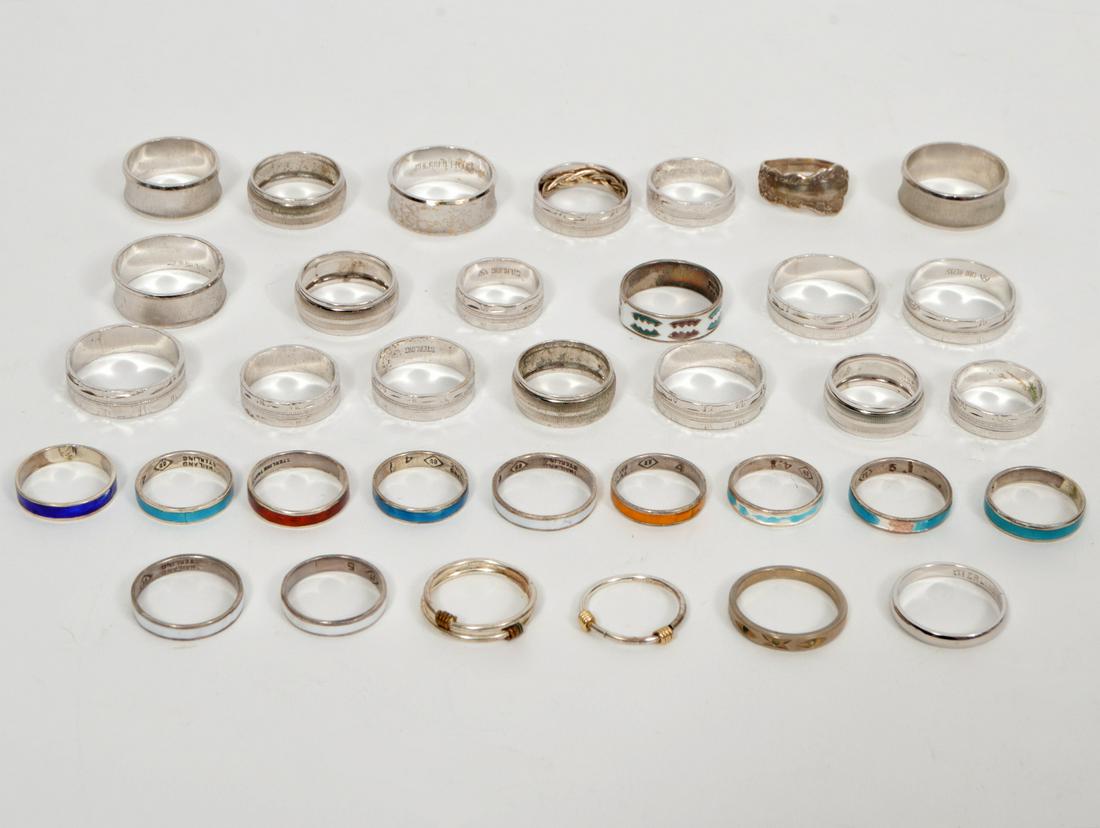 Lot of 35 New Sterling & Electroplate Bands: Lot of 35 New sterling & electroplate bands. Condition report: New. Please examine all photos closely. Contact C. Biddle Auction Gallery for more detailed information. C. Biddle Auction Gallery is not
