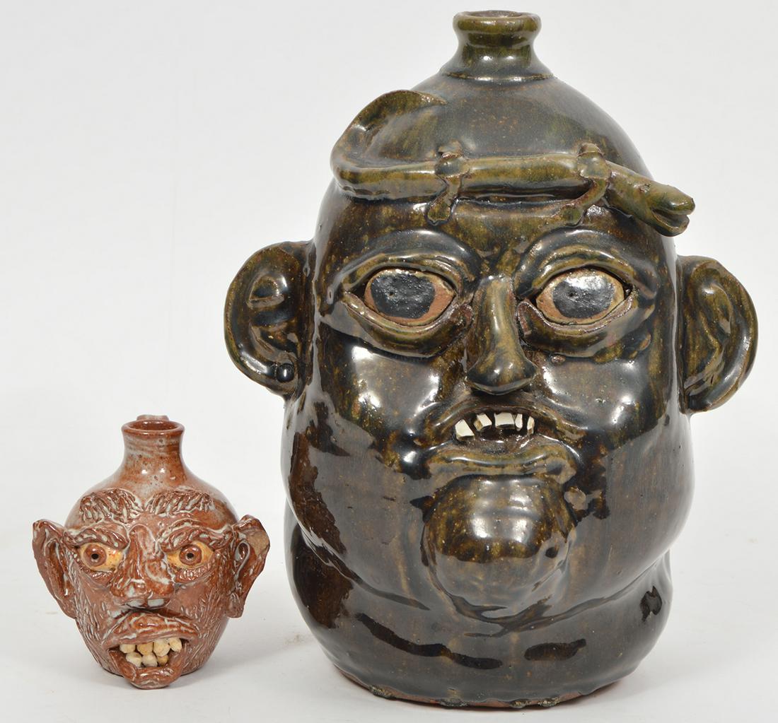 Matthew Hewell 'Ugly Face Jug' & Cole Pottery Jug: Matthew Hewell (U.S. 1972-) Matthew Hewell is part of the Hewell family, seven generations of potters. This piece of southern folk art is an 'Ugly Face Jug' in brown and black with jutting chin, space