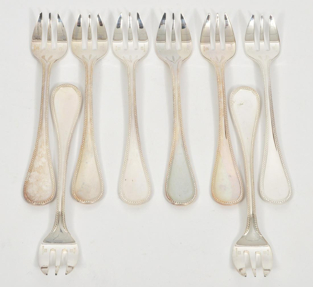 8 Christofle Silverplate 'Perles' Cocktail Forks: 8 French Christofle silverplate 'Perles' cocktail forks, measures 6". Condition report: good condition, one new in plastic, see photos.Please examine all photos closely. Contact C. Biddle Auction Gall