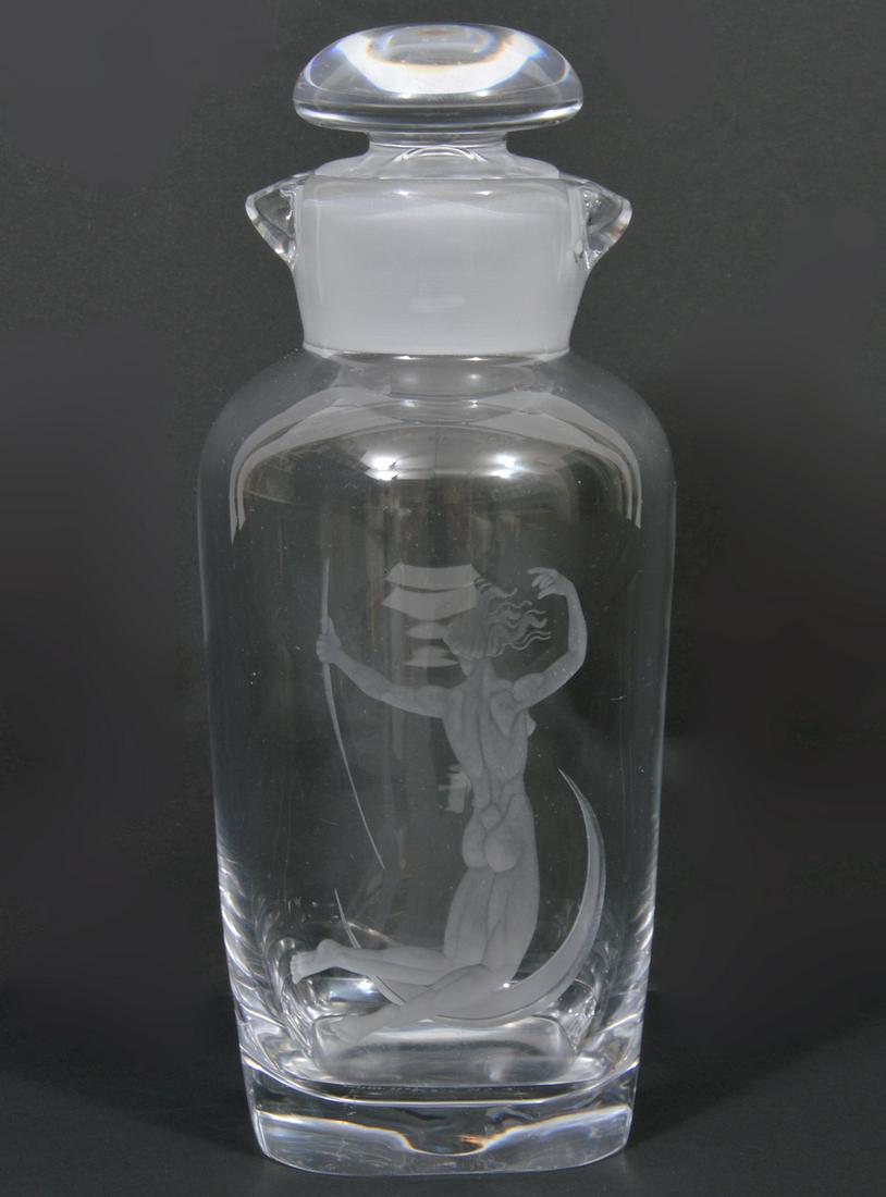 Orrefors Sweden Double Spout Cocktail Shaker: Orrefors Sweden double spout glass cocktail shaker with frosted neck and nude figure on crescent moon etched on one side. Marked on bottom 'Orrefors 2061/1714'. Measures 9.25"H x 3.75"W. Condition rep