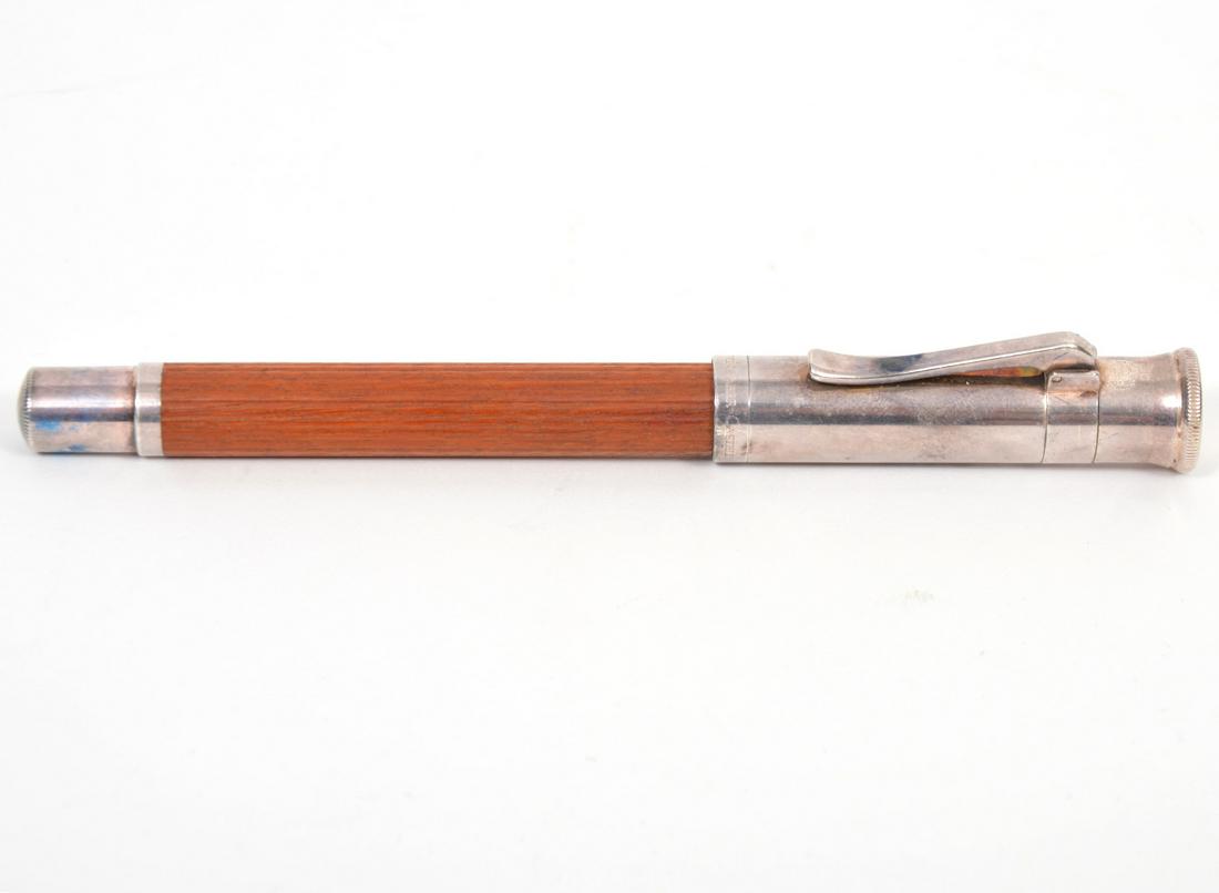 Graf von Faber-Castell Pernambuco Fountain Pen: Graf von Faber-Castell Classic Pernambucco Fountain Pen with 750 18K nib. Measures 5.25"L. Condition report: good, wear commensurate with age and use. Please examine all photos closely. Contact C. Bid