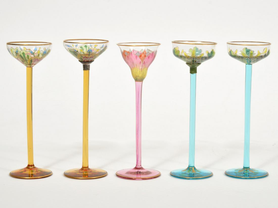 5 Austrian Meyr's Neffe Enameled Hock Wine Glasses: 5 Austrian Meyr's Neffe enameled hock wine glasses in assorted colors and designs. Markings on bottoms 2- 626, 2-628, 1-472/5. 6"H x 2" W. Condition report: Good, one is repaired, 1 is broken. Please 