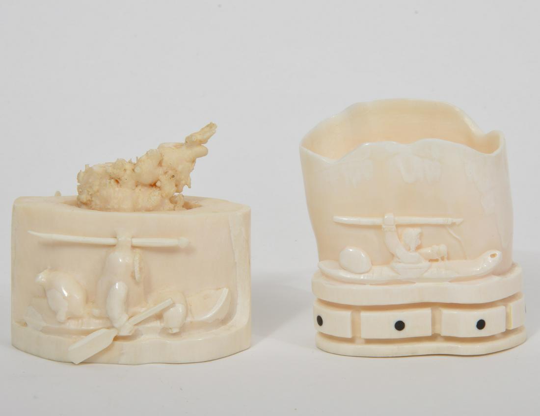 Two Alaskan Inuit Bone Carvings Artist Signed: Two hand-carved bone Alaskan Inuit figures depicting seal hunters scene. Artists' signature on underside, John Koezuna. 3"L x 3"H, David Alvanna 3.5"L x 3.5"H. Condition report: good condition, no iss