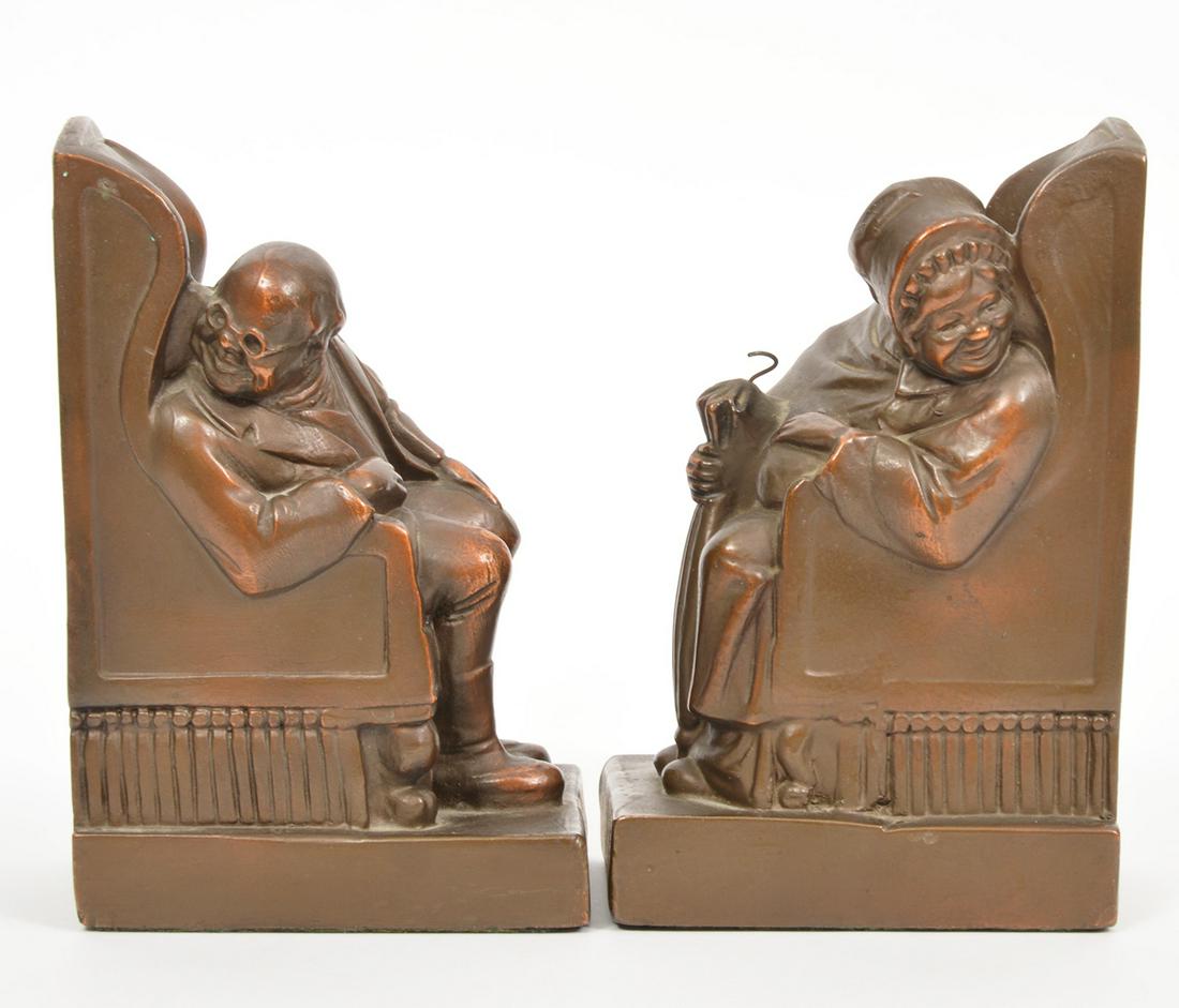 Armor Bronze Old Man & Woman Bookends: Armor Bronze old man and woman in armchair bookends. 4.25"L x 3"W x 7.5"H. Condition report: good condition, no issues, see photos. Please examine all photos closely. Contact C. Biddle Auction Gallery
