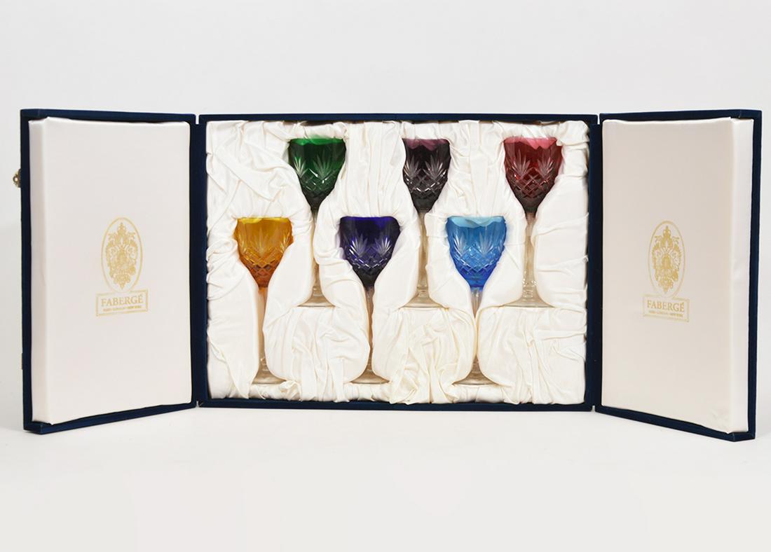 Faberge Odessa Hock Colored Crystal Wine Glasses: Set of 6 Faberge "Odessa Hock" colored crystal wine glasses with original box, 8.5"H. Box 19.5"L x 14.5"W x 5.75"H. Condition report: Good, no issues. Please examine all photos closely. Contact C. Bid
