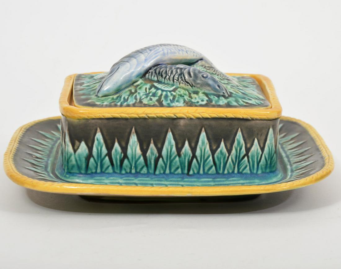 George Jones Majolica Pottery Covered Sardine Box: George Jones Majolica pottery covered sardine box with attached underplate. 3 fish in molded relief on the lid and stylized green leaves around the sides and underplate. Measures 8.5"L x 7.5"W x 3.5"H