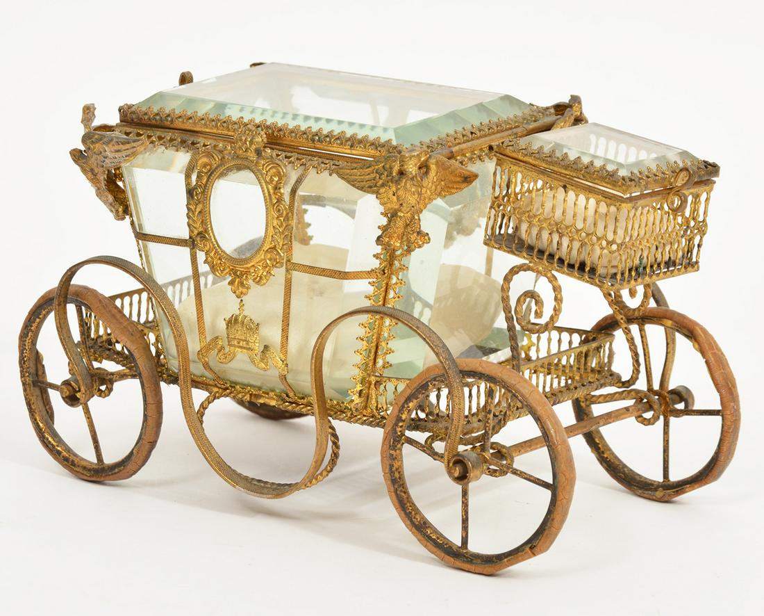 Gilt Bronze & Glass Carriage Jewelry Trinket Box: Gilt bronze and glass jewelry box in the form of a carriage. Cushions on inside. Measures 7" x 4" x 4". Condition report: Good, various wear and bends in bronze throughout ,please examine all photos c