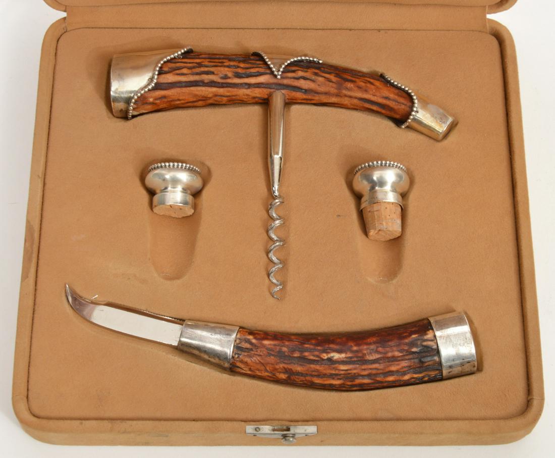 J.A. Henckels Stag Antler Sterling Wine Accessories Set: 4-Piece Stag Antler and sterling set of wine tools by J.A. Henckels of Solingen, Germany. Marked sterling. Includes corkscrew, foil cutter and two stoppers, comes in original box 10.5"L x 9.5"W x 2.5"
