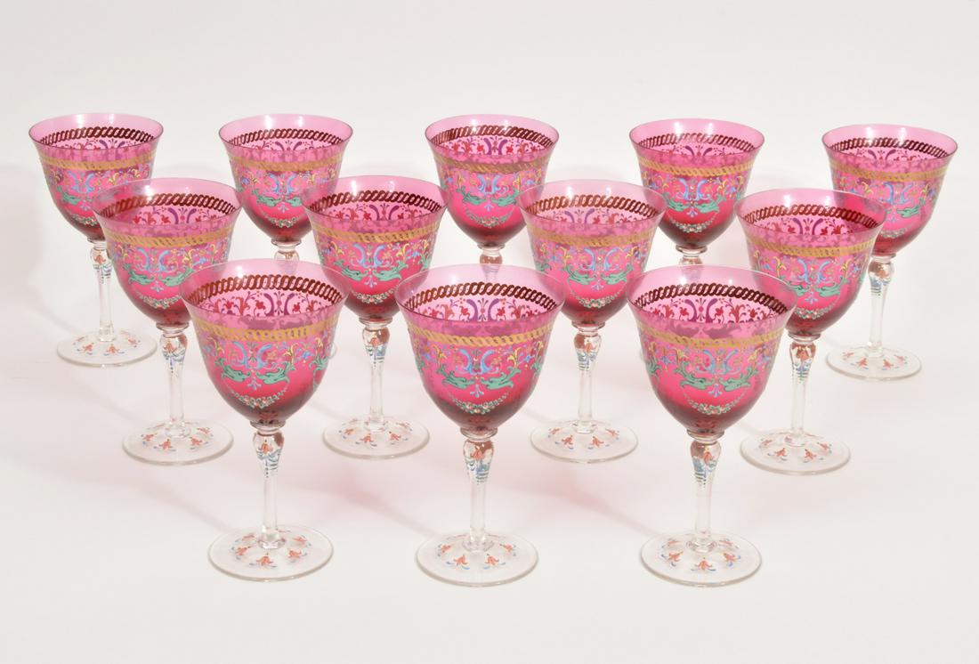 Set of 12 Bohemian Hand-Painted Goblets: Set of 12 Bohemian hand-painted wine goblets, red and clear glass with floral motif. Approx 7" tall, 3.75" wide mouth. Condition report: Good, no issues, please examine all photos closely. Contact C. 